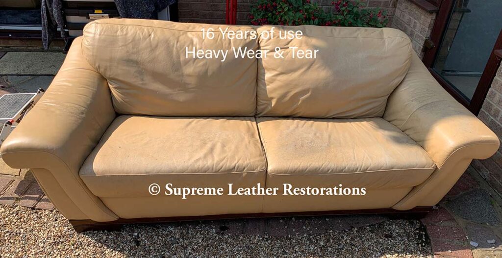 old yellow large two seater leather sofa in mustard yellow before leather restoration
