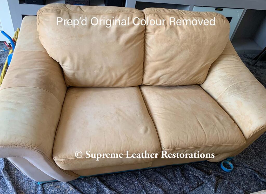 old yellow large two seater leather sofa in mustard yellow during leather restoration